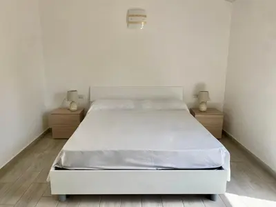 Letto o letti in una camera di Villetta 3 La Caletta