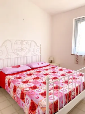 Letto o letti in una camera di Casa Borghi - Villaggio Oasy San Teodoro