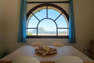 Letto o letti in una camera di [Incantevole Villetta]con Giardino e Vista mare