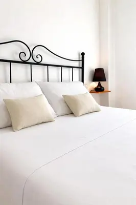 Letto o letti in una camera di Square Inn Apartment