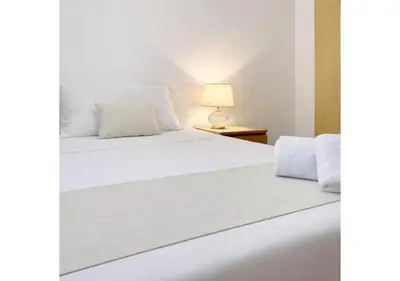 Letto o letti in una camera di Square Inn Apartment