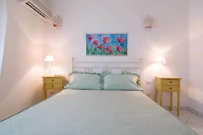 Letto o letti in una camera di Appartamento Rododendro con A/C