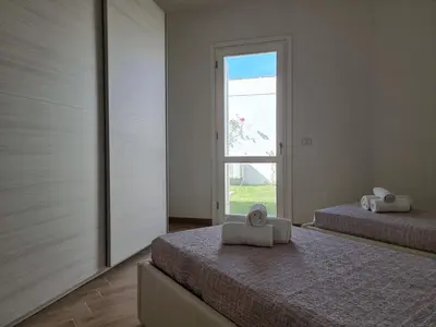 Letto o letti in una camera di Villa Lu Tizzoni