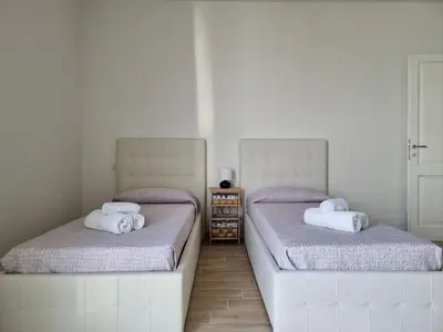 Letto o letti in una camera di Villa Lu Tizzoni