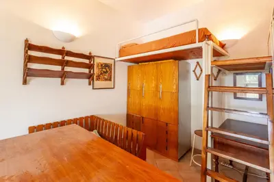 Letto o letti in una camera di Sa Domo e Aurelia