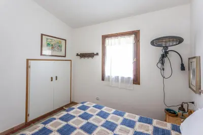 Letto o letti in una camera di Sa Domo e Aurelia