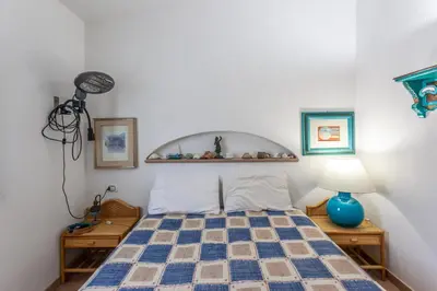 Letto o letti in una camera di Sa Domo e Aurelia