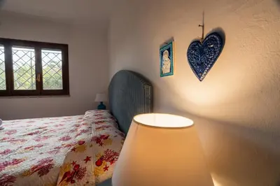 Letto o letti in una camera di Appartamento Baia Caddinas fronte mare