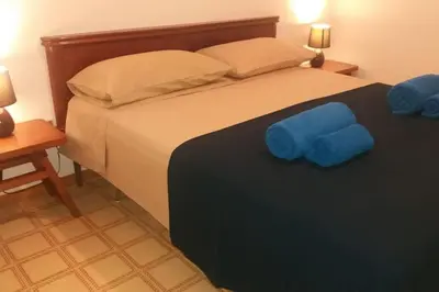 Letto o letti in una camera di Casa Cala Liberotto a 100 metri dalla spiaggia