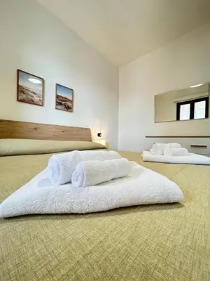 Letto o letti in una camera di Appartamento Luce