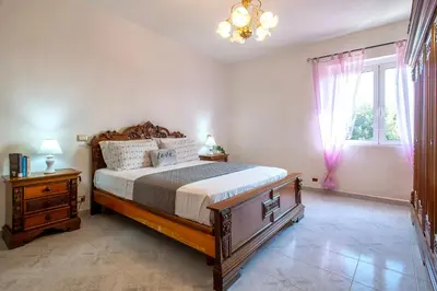 Letto o letti in una camera di Domus Cilla