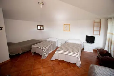 Letto o letti in una camera di Casa Iriai