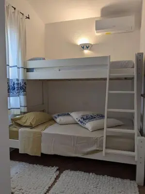 Letto o letti in una camera di Villetta Stella Marina