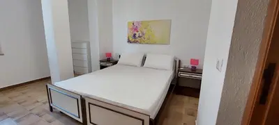 Letto o letti in una camera di VILLA PIETRAMARINA CALA LIBEROTTO appartamento 6 posti