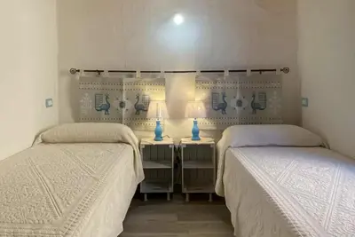 Letto o letti in una camera di Maria's Guest House Residenze Tamerici San Teodoro