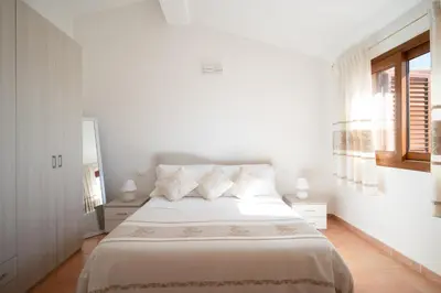 Letto o letti in una camera di Appartamento OASIS con vista mare