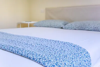 Letto o letti in una camera di Casa Aura con vista IUN R8853