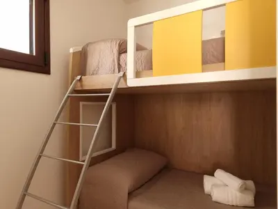 Letto o letti a castello in una camera di Villetta Roxy