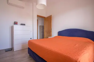 Letto o letti in una camera di GuestHost - Olbia Oasis Apartment W Two Balconies!