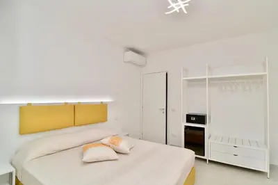 Letto o letti in una camera di Le Isole di San Teo