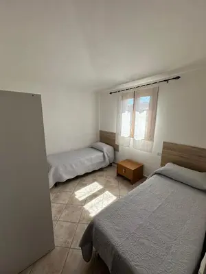 Letto o letti in una camera di Il Girasole casa vacanze