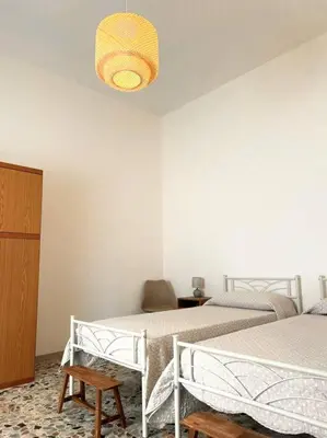 Letto o letti in una camera di Casetta Bianca con Giardino