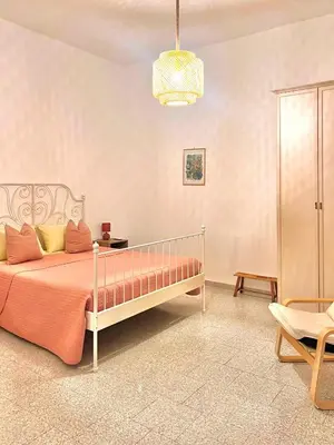 Letto o letti in una camera di Casetta Bianca con Giardino
