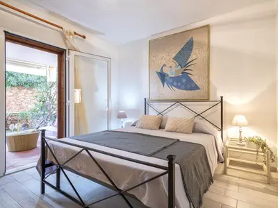 Letto o letti in una camera di Apartment D4 - I1- Baia de Bahas by Interhome