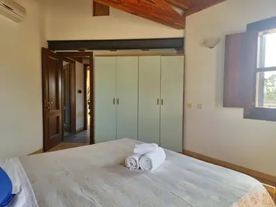 Letto o letti in una camera di Mikè House- Appartamento con balcone a Sos Alinos