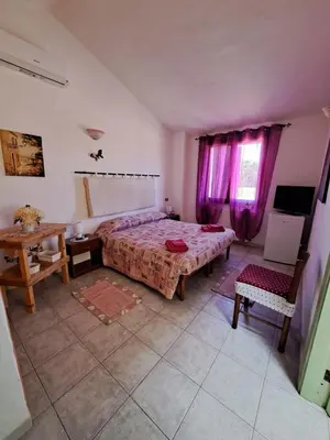Letto o letti in una camera di Lu Lisandru