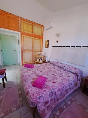 Letto o letti in una camera di Lu Lisandru