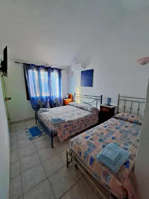 Letto o letti in una camera di Lu Lisandru