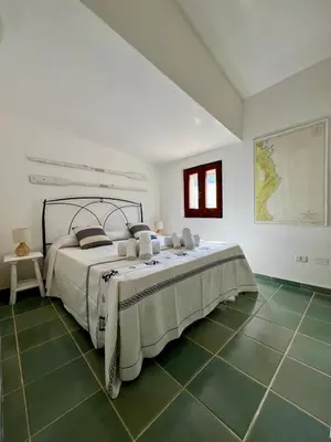 Letto o letti in una camera di Villa Peru