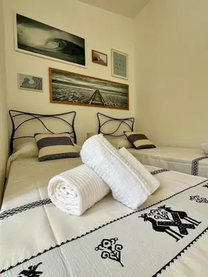 Letto o letti in una camera di Villa Peru