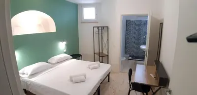Letto o letti in una camera di Casa Ribes Rooms, l'angolo tranquillo alle porte della città