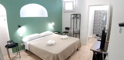Letto o letti in una camera di Casa Ribes Rooms, l'angolo tranquillo alle porte della città