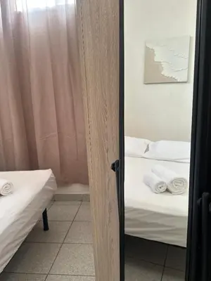 Letto o letti in una camera di Veranda Privata e BBQ -Comfort Moderno per 4 La Caletta