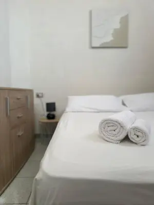 Letto o letti in una camera di Veranda Privata e BBQ -Comfort Moderno per 4 La Caletta
