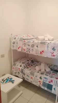Letto o letti in una camera di Domus DELEDDA 'CONCHIGLIA'