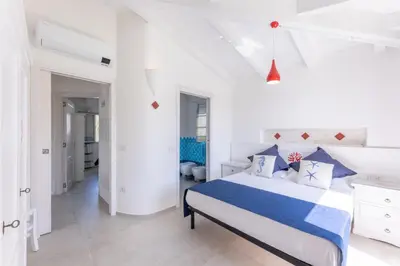 Letto o letti in una camera di Villa corallo SX Ottiolu