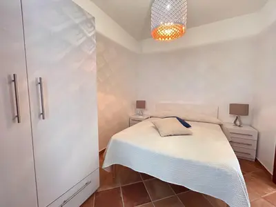 Letto o letti in una camera di Casa vacanze - Le Bacche di Maiorca