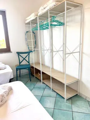 Letto o letti in una camera di Casa CLELIA