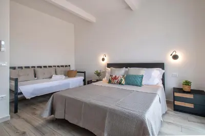 Letto o letti in una camera di Casa Ginestra