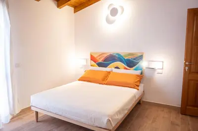 Letto o letti in una camera di Acquarello Rooms