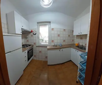 Cucina o angolo cottura di VILLA PIETRAMARINA CALA LIBEROTTO appartamento 5 posti