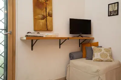TV o dispositivi per l'intrattenimento presso Iknos Suites by Wonderful Italy