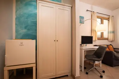TV o dispositivi per l'intrattenimento presso Iknos Suites by Wonderful Italy