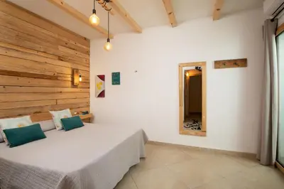 Letto o letti in una camera di Iknos Suites by Wonderful Italy