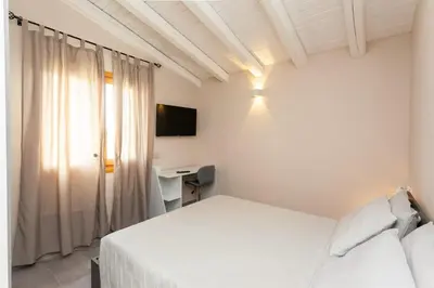 Letto o letti in una camera di B&B Il Glicine