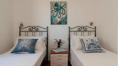 Letto o letti in una camera di Casa EOS